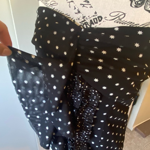 A strapless top with little tiny stars all over it. Ruffled front. - Picture 2 of 7